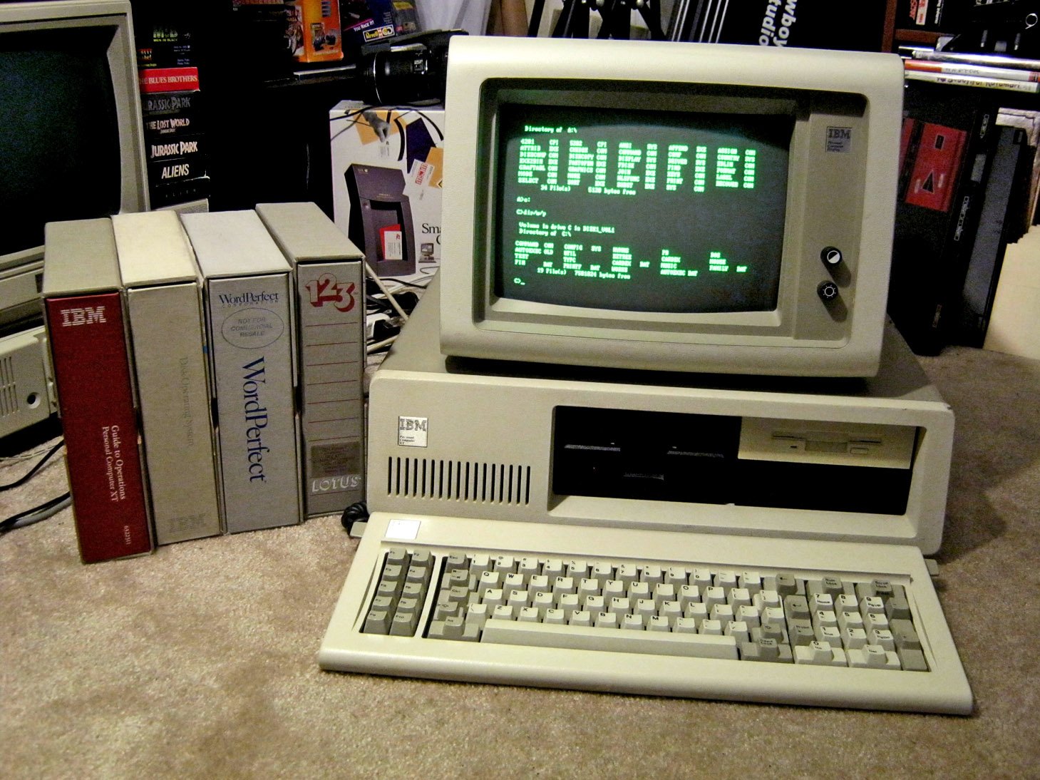 Vintage IBM Personal Computer XT with green monochrome display and manuals