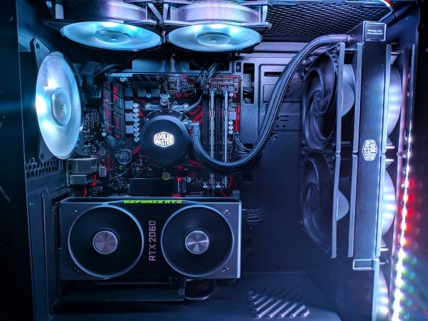 Inside a custom PC build with liquid cooling and a vertically mounted graphics card